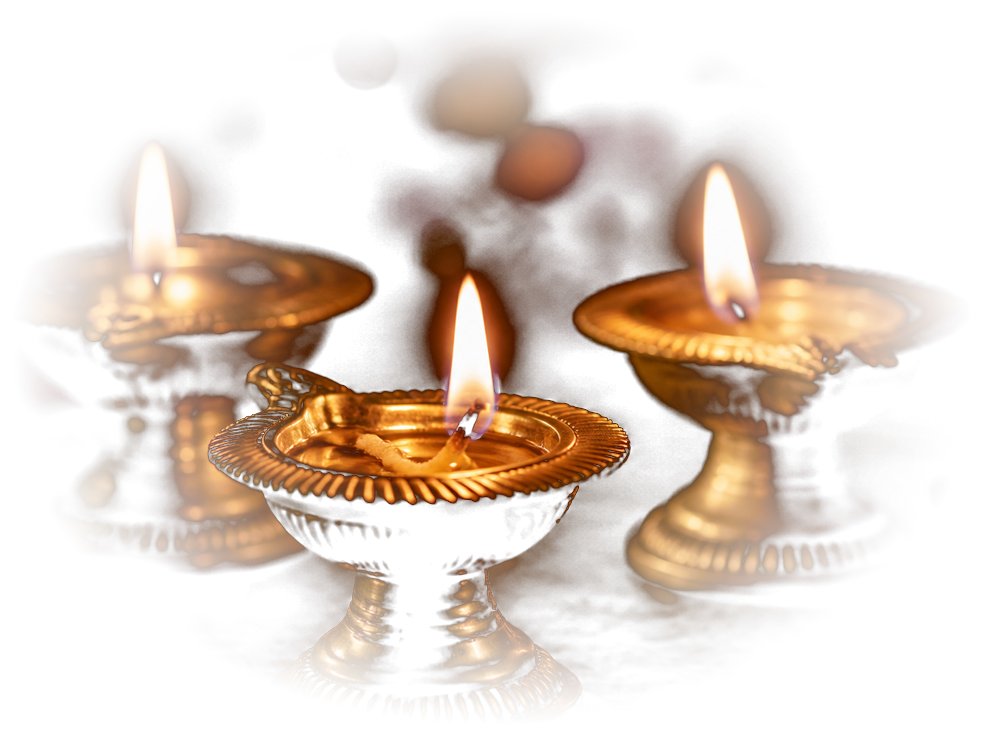 Lit diyas glowing in the dark